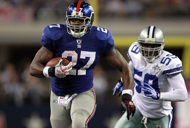 ARLINGTON, TX - OCTOBER 25:  Running back Brandon Jacobs #27 of the New York Giants runs for a touchdown past Brandon Williams #59 of the Dallas Cowboys at Cowboys Stadium on October 25, 2010 in Arlington, Texas.  (Photo by Ronald Martinez/Getty Images)