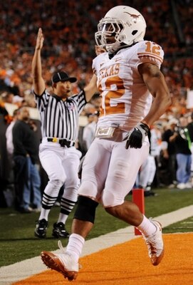 STILLWATER, OK - OCTOBER 31:  Earl Thomas #12 of the Texas Longhorns runs in to score a touchdown on an interception in the third quarter against the Oklahoma State Cowboys at Boone Pickens Stadium on October 31, 2009 in Stillwater, Oklahoma.  (Photo by R