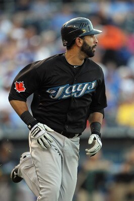 KANSAS CITY, MO - JULY 19:  Jose Bautista #19 of the Toronto Blue Jays watches a fly ball during the game against the Kansas City Royals on July 19, 2010 at Kauffman Stadium in Kansas City, Missouri.  (Photo by Jamie Squire/Getty Images)