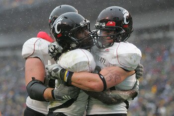 PITTSBURGH - DECEMBER 05:  Mardy Gilyard #1 of the Cincinnati Bearcats celebrates with teammates after scoring a touchdown in the fourth quarter against the University of Pittsburgh Panthers on December 5, 2009 at Heinz Field in Pittsburgh, Pennsylvania. 