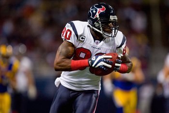ST. LOUIS - DECEMBER 20:  Andre Johnson #80 of the Houston Texans carries the ball during the game against the St. Louis Rams at Edward Jones Dome on December 20, 2009 in St. Louis, Missouri.  (Photo by Dilip Vishwanat/Getty Images)