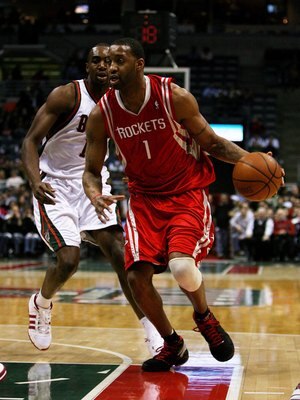 MILWAUKEE - FEBRUARY 09: Tracy McGrady #1 of the Houston Rockets drives past Luc Richard Mbah a Moute #12 of the Milwaukee Bucks on February 9, 2009 at the Bradley Center in Milwaukee, Wisconsin. The Bucks defeated the Rockets 124-112. NOTE TO USER: User