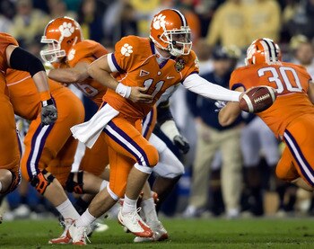 TAMPA - DECEMBER 05:  Quarterback Kyle Parker #11 of the Clemson Tigers hands the ball off against the Georgia Tech Yellow Jackets in the 2009 ACC Football Championship game at Raymond James Stadium on December 5, 2009 in Tampa, Florida.  (Photo by J. Mer