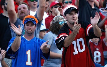 JACKSONVILLE, FL - OCTOBER 31:  A fan of the Florida Gators and a fan of the Georgia Bulldogs cheer beside one another at Jacksonville Municipal Stadium on October 31, 2009 in Jacksonville, Florida.  (Photo by Kevin C. Cox/Getty Images)