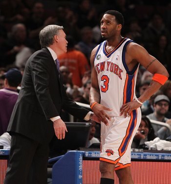 NEW YORK - FEBRUARY 20:  Tracy McGrady #3 of the New York Knicks walks past head coach Mike D'Antoni against the Oklahoma City Thunder at Madison Square Garden on February 20, 2010 in New York, New York. NOTE TO USER: User expressly acknowledges and agree