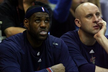 ORLANDO, FL - MAY 26:  LeBron James #23 and Zydrunas Ilgauskas #11 of the Cleveland Cavaliers look on from the bench during the game against the Orlando Magic in Game Four of the Eastern Conference Finals during the 2009 NBA Playoffs at the Amway Arena on