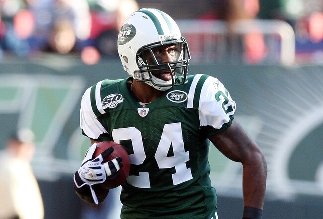 EAST RUTHERFORD, NJ - NOVEMBER 29:  Darrelle Revis #24 of the New York Jets runs the ball in for a first quarter touchdown after an interception against the Carolina Panthers on November 29, 2009 at Giants Stadium in East Rutherford, New Jersey.  (Photo b