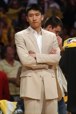 LOS ANGELES - JUNE 7:  Sun Yue #9 of the Los Angeles Lakers looks on from the sideline in Game Two of the 2009 NBA Finals against the Orlando Magic at Staples Center on June 7, 2009 in Los Angeles, California.  The Lakers won 101-96 in overtime.  NOTE TO