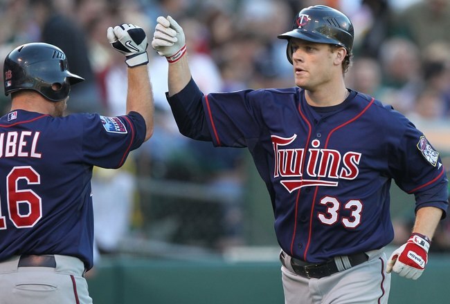 OAKLAND, CA - JUNE 04:  Justin Morneau #33 of the Minnesota Twins celebrates after hitting a two run home run against the Oakland Athletics in the first inning during an MLB game at the Oakland-Alameda County Coliseum on June 4, 2010 in Oakland, Californi