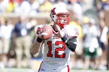 ANN ARBOR, MI - SEPTEMBER 6:  Quarterback Daniel Raudabaugh  #12 of the Miami of Ohio Red Hawks looks to make a pass play during the game against the Michigan Wolverines on September 6, 2008 at Michigan Stadium in Ann Arbor, Michigan.  The Wolverines defe