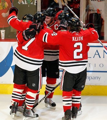 CHICAGO - APRIL 24: (L-R) Patrick Kane #88, Brent Seabrook #7, Jonathan Toews #19, Patrick Sharp #10 and Duncan Keith #2 of the Chicago Blackhawks celebrate a goal by Kane with 13 seconds left in regulation time against the Nashville Predators in Game Fiv