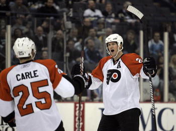 PITTSBURGH, PA - JANUARY 7: Chris Pronger #20 of the Philadelphia Flyers celebrates his goal with Matt Carle #25 against the Pittsburgh Penguins in the second period at Mellon Arena on January 7, 2010 in Pittsburgh, Pennsylvania. (Photo by Justin K. Aller