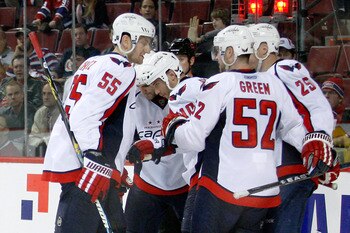 MONTREAL- APRIL 19:  Members of the Washington Capitals celebrate the third period goal from Matt Bradley #10 in Game Three of the Eastern Conference Quarterfinals during the 2010 NHL Stanley Cup Playoffs against the Montreal Canadiens at the Bell Centre