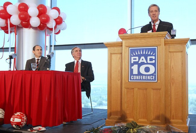 SALT LAKE CITY, UT - JUNE 17: Utah Athletic Director Dr. Chris Hill (R) talks as PAC-10 Commissioner Larry Scott (L) and President of the University of Utah Michael Young (C) listen as the University was admitted into the PAC-10 June 17, 2010 in Salt Lake