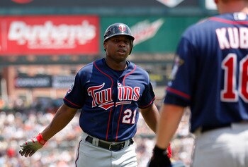 DETROIT - JULY 11: Delmon Young #21 of the Minnesota Twins scores on a double off the bat of Michael Cuddyer to deep left center field in the fifth inning during the game against the Detroit Tigers on July 11, 2010 at Comerica Park in Detroit, Michigan. T