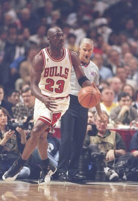 4 Jun 1997: Guard Michael Jordan of the Chicago Bulls dribbles down the court during a playoff game against the Utah Jazz at the United Center in Chicago, Illinois. The Bulls won the game 97-85.