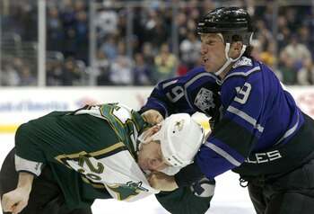 LOS ANGELES - DECEMBER 4:  Sean Avery #19 of the Los Angeles Kings fights with Steve Ott #29 of the Dallas Stars during the first period of the game on December 4, 2003 at Staples Center in Los Angeles, California.  (Photo by Robert Laberge/Getty Images)