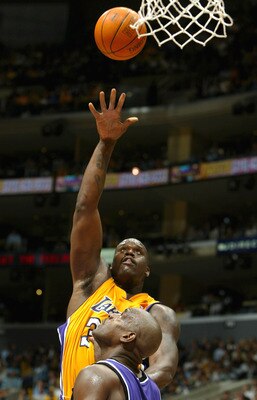 LOS ANGELES - MARCH 24:  Shaquille O'Neal #34 of the Los Angeles Lakers puts a shot up over Chris Webber #4 of the Sacramento Kings during the game at Staples Center on March 24, 2004 in Los Angeles, California.  NOTE TO USER: User expressly acknowledges