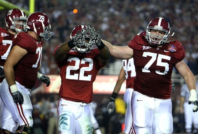 PASADENA, CA - JANUARY 07:  Running back Mark Ingram #22 of the Alabama Crimson Tide celebrates a touchdown with teammates against the Texas Longhorns in the second quarter of the Citi BCS National Championship game at the Rose Bowl on January 7, 2010 in