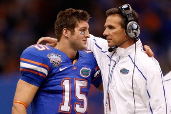 NEW ORLEANS - JANUARY 01:  Tim Tebow #15 of the Florida Gators hugs his head coach Urban Meyer after scoring a touchdown against the Cincinnati Bearcats during the Allstate Sugar Bowl at the Louisana Superdome on January 1, 2010 in New Orleans, Louisiana.
