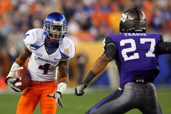 GLENDALE, AZ - JANUARY 04:  Titus Young #4 of the Boise State Broncos runs after a catch against Jason Teague #27 of the TCU Horned Frogs during the Tostitos Fiesta Bowl at the Universtity of Phoenix Stadium on January 4, 2010 in Glendale, Arizona.  (Phot