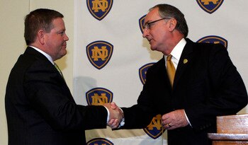 SOUTH BEND, IN - DECEMBER 11: Notre Dame atheletic director Jack Swarbrick (R) greets Brian Kelly as he is introduced as the new football head coach at Notre Dame University on December 11, 2009 in South Bend, Indiana.  Kelly most recently led the Univers
