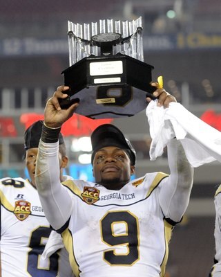 TAMPA, FL - NOVEMBER 28: Quarterback Josh Nesbitt #9 of the Georgia Tech Yellow Jackets celebrates a victory against the Clemson Tigers in the 2009 ACC Football Championship Game December 5, 2009 at Raymond James Stadium in Tampa, Florida.  (Photo by Al M