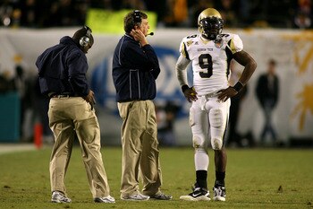 MIAMI GARDENS, FL - JANUARY 05:  Head coach Paul Johnson of the Georgia Tech Yellow Jackets talks with quarterback Josh Nesbitt #9 against the Iowa Hawkeyes during the FedEx Orange Bowl at Land Shark Stadium on January 5, 2010 in Miami Gardens, Florida.  