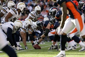 DENVER - NOVEMBER 22:  The Denver Broncos offense faces off against the San Diego Chargers defense on the line of scrimmage during NFL action at Invesco Field at Mile High on November 22, 2009 in Denver, Colorado. The Chargers defeated the Broncos 32-3.  