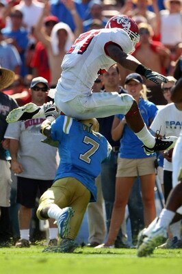 PASADENA, CA - SEPTEMBER 27:  Ryan Matthews #21 of the Frenso State Bulldogs jumps over Courtney Viney #7 of the UCLA Bruins en route to a touchdown in the third quarter of the game on September 27, 2008 at the Rose Bowl in Pasadena, California.  (Photo b