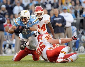 SAN DIEGO - NOVEMBER 29:  Vincent Jackson #83 of the San Diego Chargers is tackled by Andy Studebaker #96 and Brandon Flowers #24 of the Kansas City Chiefs during the game at Qualcomm Stadium on November 29, 2009 in San Diego, California.  (Photo by Harry