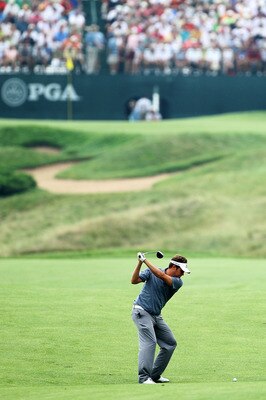 KOHLER, WI - AUGUST 13:  Jeff Overton hits his approach shot on the 16th hole during the continuation of the first round of the 92nd PGA Championship on the Straits Course at Whistling Straits on August 13, 2010 in Kohler, Wisconsin.  (Photo by Andy Lyons