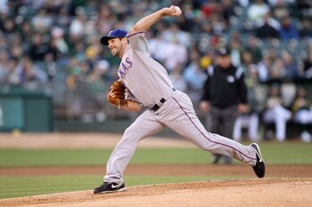 OAKLAND, CA - AUGUST 06:  Cliff Lee #33 of the Texas Rangers pitches against the Oakland Athletics at the Oakland-Alameda County Coliseum on August 6, 2010 in Oakland, California.  (Photo by Ezra Shaw/Getty Images)
