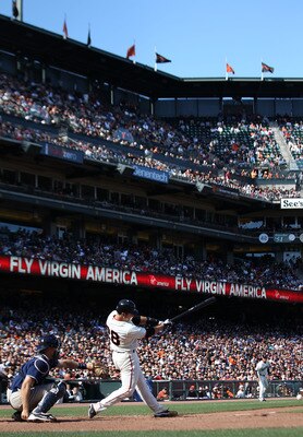 SAN FRANCISCO - AUGUST 14:  Buster Posey #28 of the San Francisco Giants doubles in the eleventh inning against the San Diego Padres during an MLB game at AT&T Park on August 14, 2010 in San Francisco, California.  (Photo by Jed Jacobsohn/Getty Images)