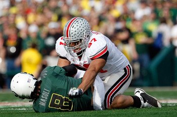 PASADENA, CA - JANUARY 01:  Defensive lineman Cameron Heyward #97 of the Ohio State Buckeyes sacks quarterback Jeremiah Masoli #8 of the Oregon Ducks during the 96th Rose Bowl game on January 1, 2010 in Pasadena, California.  (Photo by Jeff Gross/Getty Im
