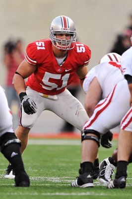 COLUMBUS, OH - OCTOBER 10:  Linebacker Ross Homan #51 of the Ohio State Buckeyes waits for the snap against the Wisconsin Badgers at Ohio Stadium on October 10, 2009 in Columbus, Ohio.  (Photo by Jamie Sabau/Getty Images)