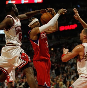 CHICAGO - FEBRUARY 20: Allen Iverson #3 of the Philadelphia 76ers looses control of the ball after being hit by Ronald Murray #6 of the Chicago Bulls as Brad Miller #52 defends at the United Center on February 20, 2010 in Chicago, Illinois. The Bulls defe