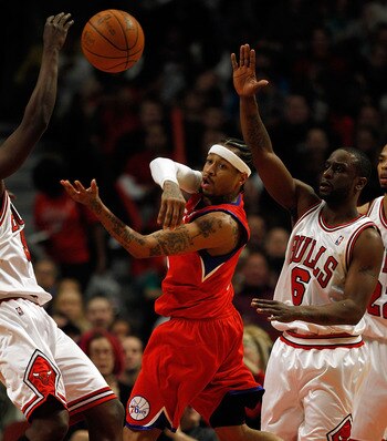 CHICAGO - FEBRUARY 20: Allen Iverson #3 of the Philadelphia 76ers passes the ball under pressure from Ronald Murray #6 of the Chicago Bulls at the United Center on February 20, 2010 in Chicago, Illinois. The Bulls defeated the 76ers 122-90. NOTE TO USER: 