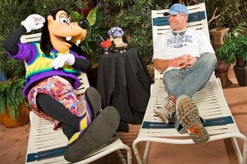 LAKE BUENA VISTA, FL - FEBRUARY 28:  In this handout photo provided by Walt Disney World, in a photo taken February 28, 2009 NFL quarterback Brett Favre lounges with Goofy at Walt Disney World Resort in Lake Buena Vista, Florida.  Favre was appearing at '