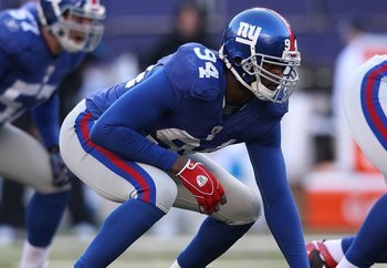EAST RUTHERFORD, NJ - DECEMBER 27:  Mathias Kiwanuka #94 of the New York Giants against the Carolina Panthers at Giants Stadium on December 27, 2009 in East Rutherford, New Jersey.  (Photo by Nick Laham/Getty Images)