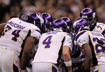 NEW ORLEANS - JANUARY 24:  (L-R) Bryant McKinnie #74, Brett Favre #4 and Adrian Peterson #28 of the Minnesota Vikings stand in the offensive huddle against the New Orleans Saints during the NFC Championship Game at the Louisiana Superdome on January 24, 2