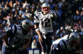 SAN DIEGO - JANUARY 14: Quarterback Tom Brady #12 of the New England Patriots points in the second quarter against the San Diego Chargers during the AFC Divisional Playoff Game held on January 14, 2007 at Qualcomm Stadium in San Diego, California.  (Photo
