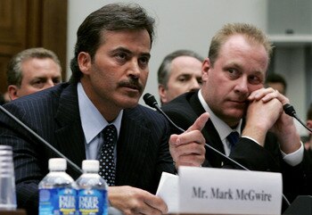 WASHINGTON - MARCH 17:  Baltimore Oriole Rafael Palmeiro testifies as Boston Red Sox pitcher Curt Schilling listens during a House Committe session investigating Major League Baseball's effort to eradicate steroid use on Capital Hill March 17, 2005 in Was