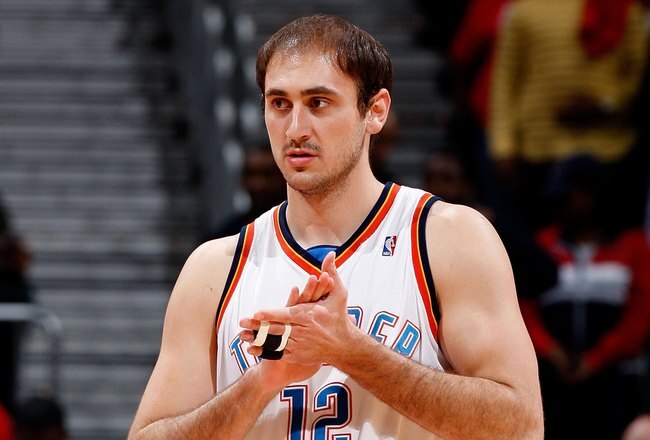 ATLANTA - JANUARY 18:  Nenad Krstic #12 of the Oklahoma City Thunder against the Atlanta Hawks at Philips Arena on January 18, 2010 in Atlanta, Georgia.  NOTE TO USER: User expressly acknowledges and agrees that, by downloading and/or using this Photograp