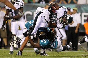 PHILADELPHIA - AUGUST 13: LeSean McCoy #25 of the Philadelphia Eagles is tackled by Reggie Nelson #25 of the Jacksonville Jaguars during their preseason game at Lincoln Financial Field on August 13, 2010 in Philadelphia, Pennsylvania.  (Photo by Nick Laha