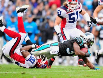 CHARLOTTE, NC - OCTOBER 25:  Jarius Byrd #31 of the Buffalo Bills tackles DeAngelo Williams #34 of the Carolina Panthers  during the first quarter at Bank of America Stadium on October 25, 2009 in Charlotte, North Carolina.  (Photo by Grant Halverson/Gett