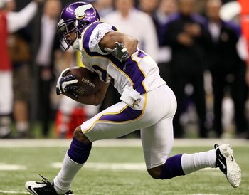 NEW ORLEANS - JANUARY 24:  Percy Harvin #12 of the Minnesota Vikings returns a punt against the New Orleans Saints during the NFC Championship Game at the Louisiana Superdome on January 24, 2010 in New Orleans, Louisiana. The Saints won 31-28 in overtime.