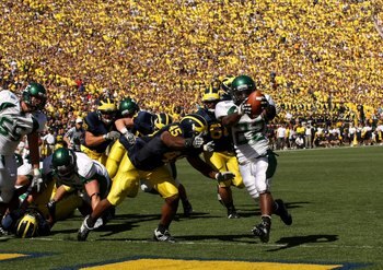 ANN ARBOR, MI - SEPTEMBER 19:  Running back Dwayne Priest #22 of the Eastern Michigan Eagles celebrates as he scores on a  five yard touchdown run in the second quarter against the Michigan Wolverines  at Michigan Stadium on September 19, 2009 in Ann Arbo