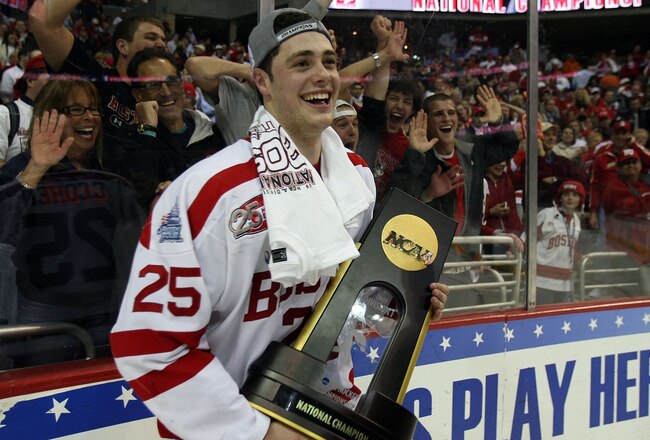 WASHINGTON - APRIL 11:  Colby Cohen #25 of the Boston Terriers celebrates with the championship trophy after defeating the Miami Red Hawks during the NCAA Men's Frozen Four Championship game on April 11, 2009 at the Verizon Center in Washington, DC. Bosto