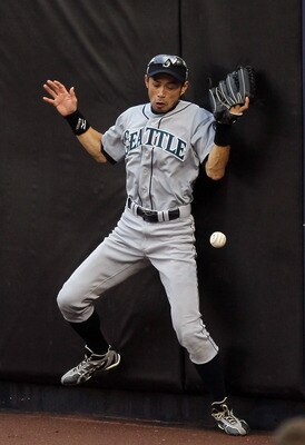 NEW YORK - AUGUST 22:  Ichiro Suzuki #51 of the Seattle Mariners can not keep the ball in his glove on a ball hit for a double by Nick Swisher (not pictured) of the New York Yankees during the fifth inning on August 22, 2010 at Yankee Stadium in the Bronx